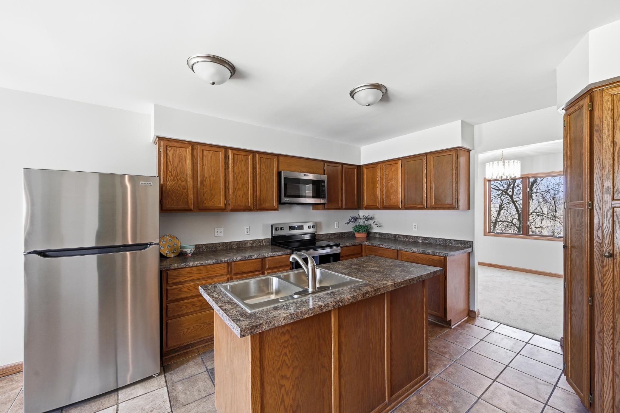 Modern kitchen updated with stainless steel appliances and plenty of counter space for meal prep.