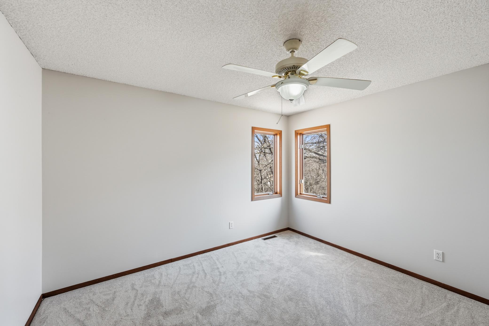 Upper level bedroom with new carpet, fresh paint and large closet.