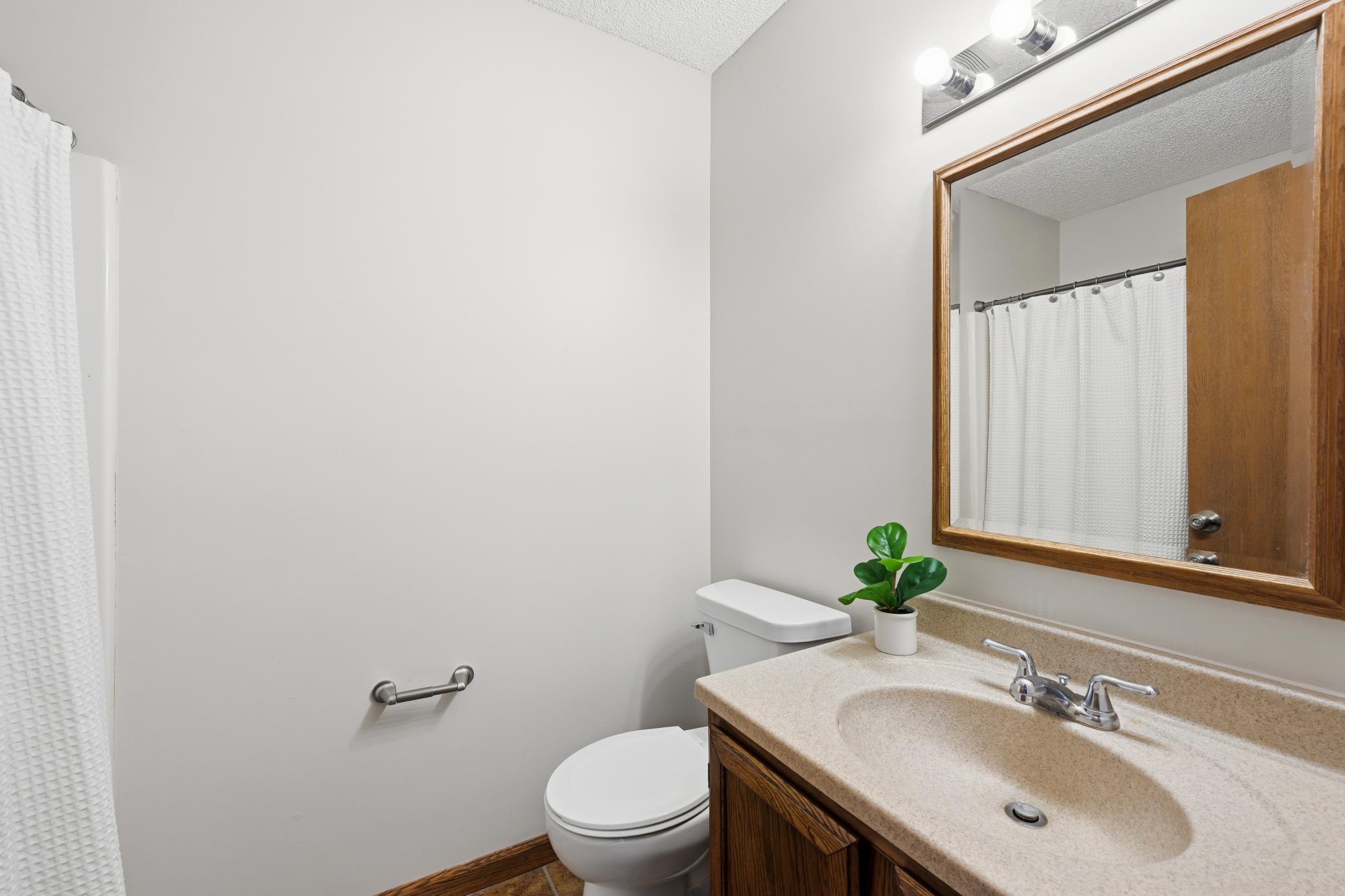 Convenient 3/4 lower level bathroom, perfectly situated for guests or use from the family room.