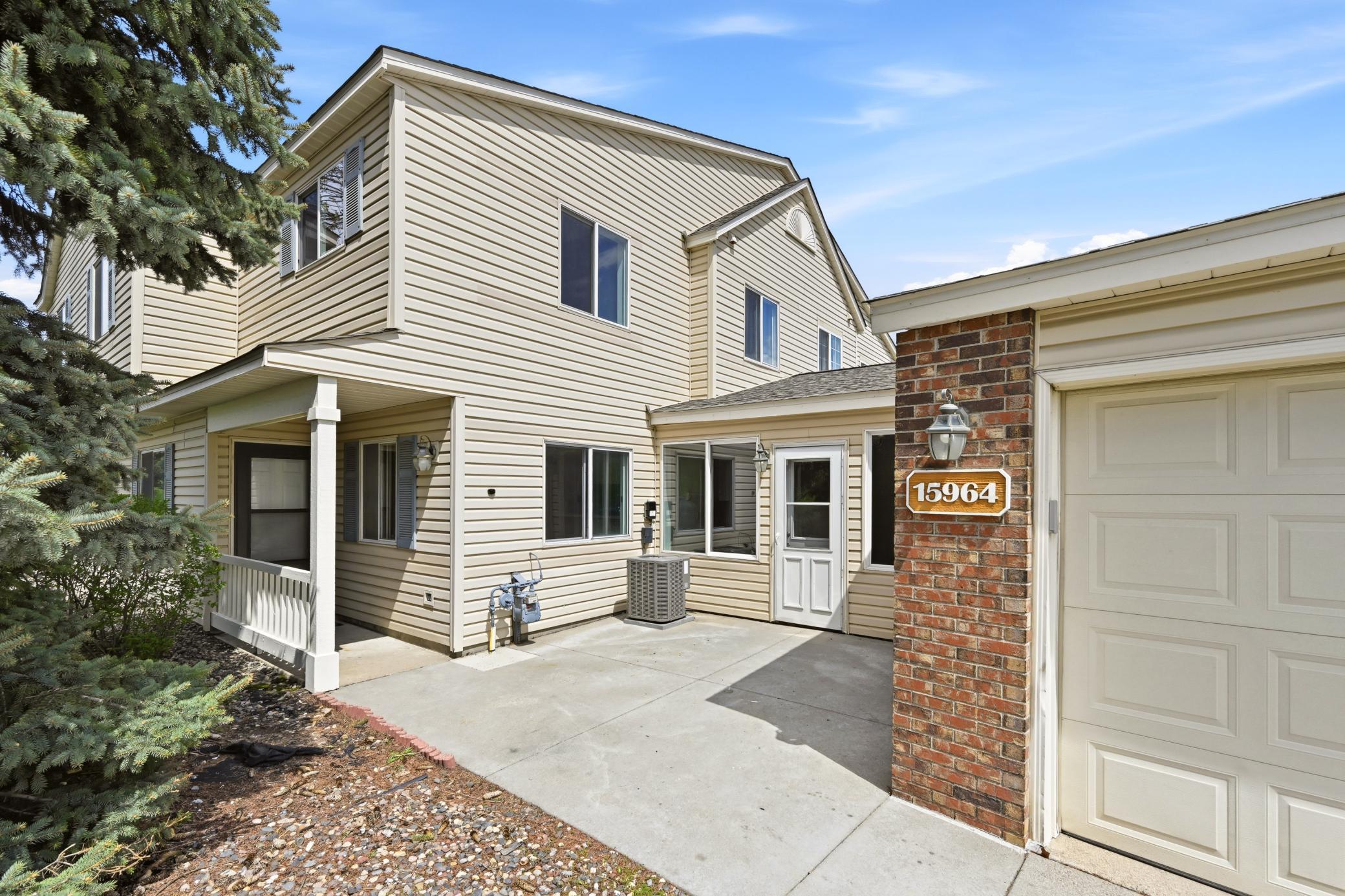 Welcome home! This charming two story residence features a sunny exterior and an attached two-car garage.