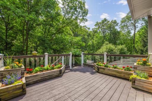 Step out from the three-season porch and take a deep breath on the deck. Adorned with built-in planters and low-maintenance composite decking, this inviting space is perfect for sunbathing, relaxing, or simply soaking in the natural surroundings.
