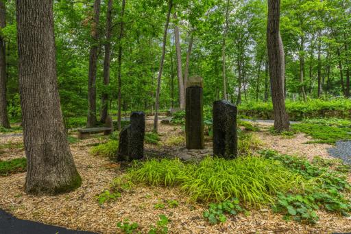 Greeting you upon entering the property, three basalt pillars quietly cascade water down onto the stones below.