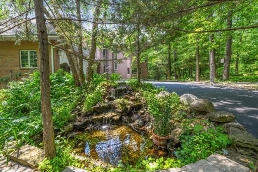 A thoughtfully placed water feature with a cascading waterfall.