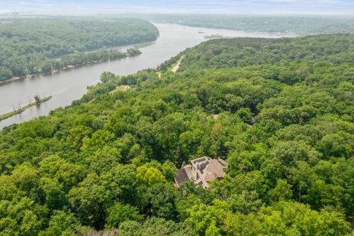 Facing south, looking toward the Historic Boom Site and the city of Stillwater, this home sits on the bluffs of the St. Croix River.