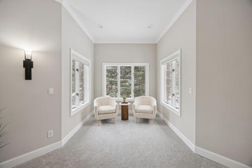 A cozy reading nook in the ownerâs suite, offering a quiet spot with beautiful views.