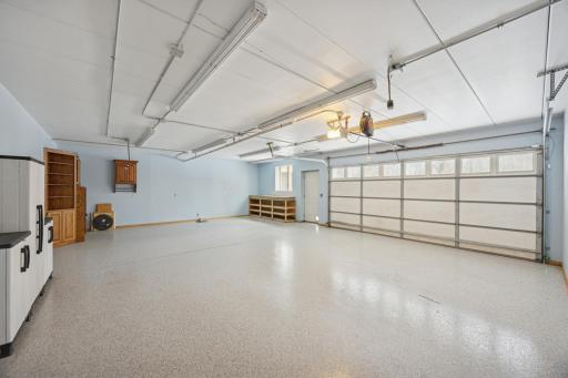 The three-car tuck-under garage is fully insulated, heated, and features an epoxy floor. Perfectly set up for a workshop, hobby space, or storing all your âtoys.â