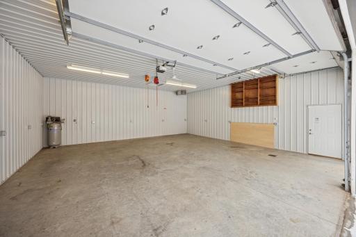 The first section of the pole building is a 32' x 30' insulated, heated space finished with durable steel siding. Two overhead doors provide easy in-and-out access for vehicles, campers, toys, or workshop use.