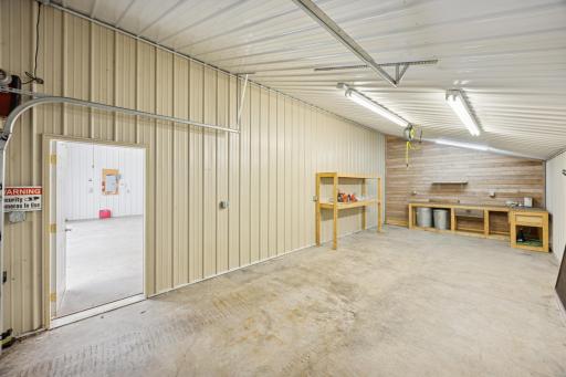 A 12' x 30' section of the outbuilding offers concrete flooring, steel siding, and excellent lighting, ideal for cold storage needs.