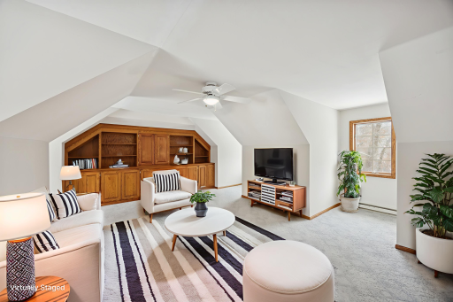 The bonus room features built-in bookshelves to keep the space organized and dormer windows that add depth, natural light, and inspiration. This versatile room is perfect for crafting, gaming, or pursuing your favorite hobbies.