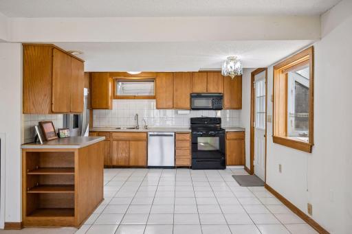 The kitchen and dining area that leads outside to the beautiful water feature.