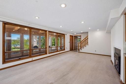 Once you head downstairs you will see your living room with views from your screened in porch, or head to the family room.