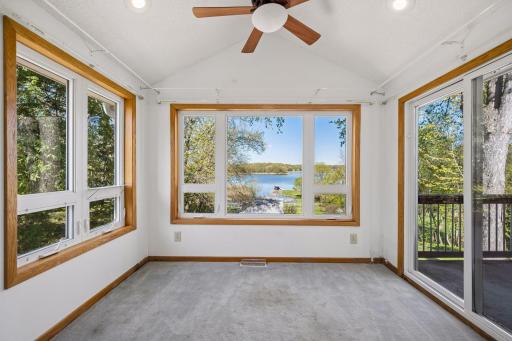 The primary bedroom has its own sunroom and deck area to enjoy.