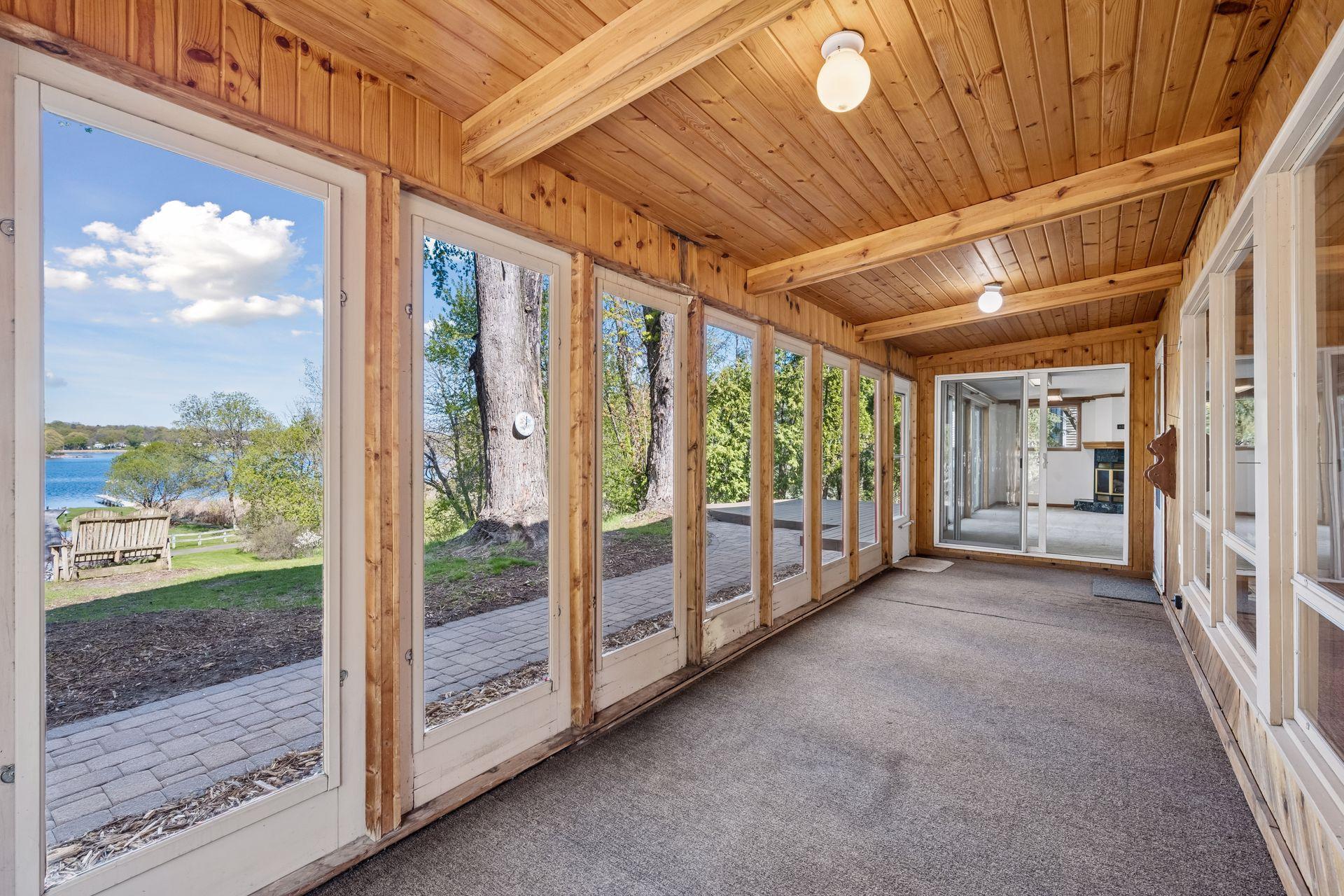 The screened-in porch with access to and gorgeous views of Fish Lake.