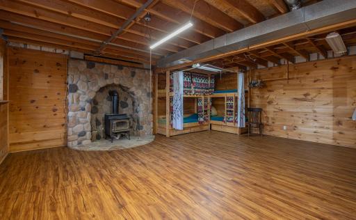 Beautiful wood burning fireplace in lower sleeping/flex space