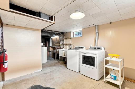 Laundry and Utility room with a small workbench and under stair storage