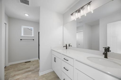 Owner's bathroom. Photo of the same floorplan in a different community.