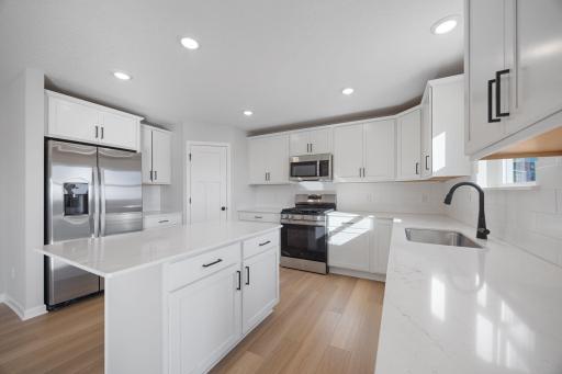 Kitchen. Photo of the same floorplan in a different community.