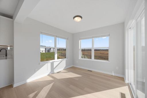 Morning room off the kitchen. Photo of the same floorplan in a different community.