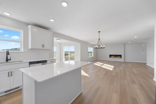 Wide open main level. Photo of the same floorplan in a different community.