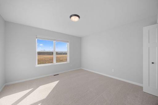 Bedroom 5. Photo of the same floorplan in a different community.