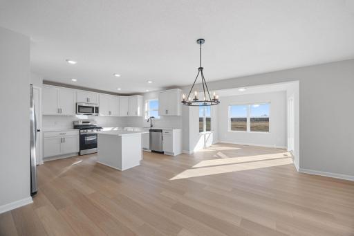 Main level dining space looking towards morning room. Photo of same floorplan in a different community.