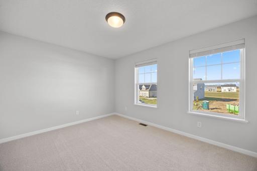 Bedroom 4. Photo of the same floorplan in a different community.