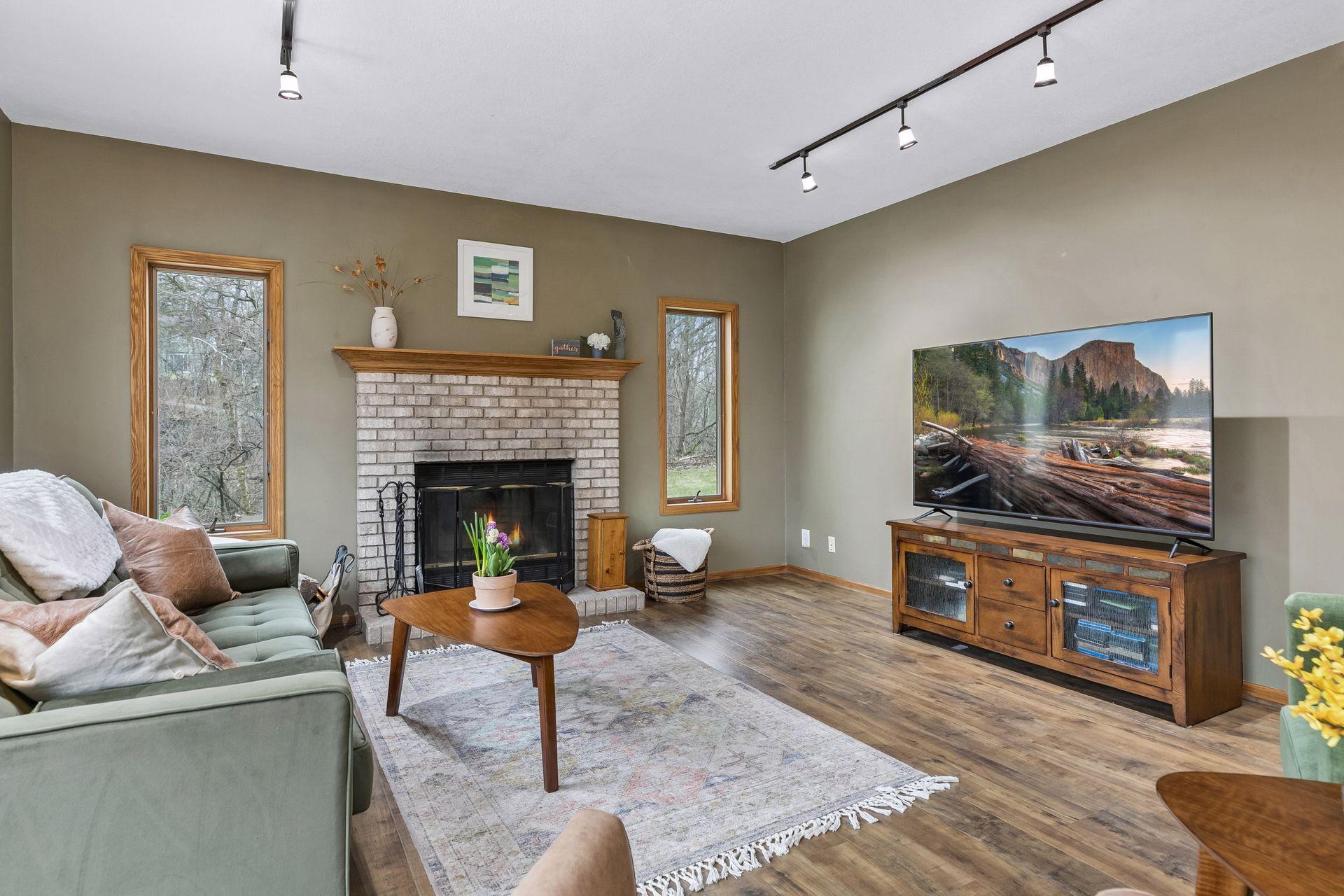 Fireplace centerpiece in this bright living area