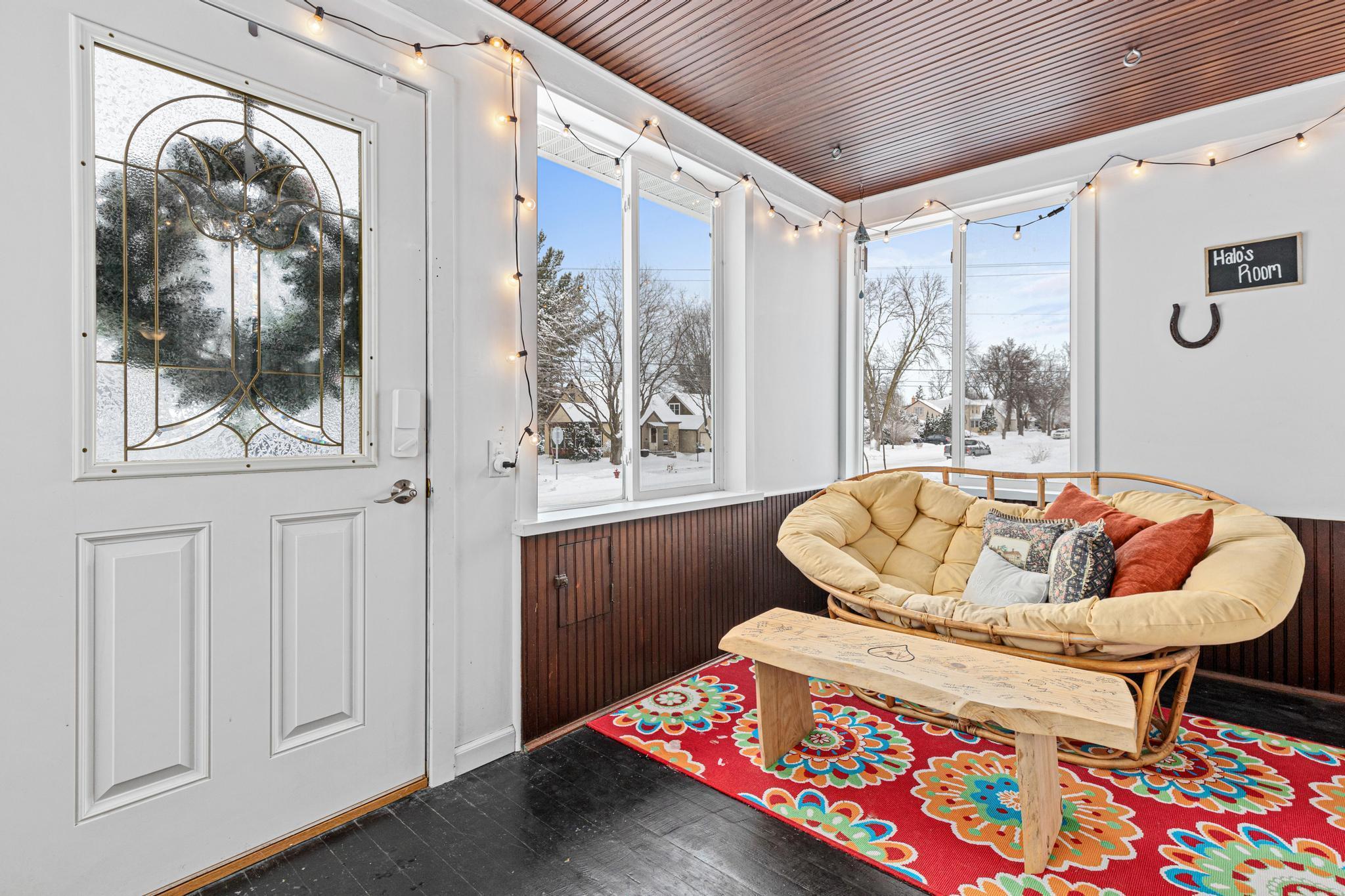 Adorable front porch with wood ceiling