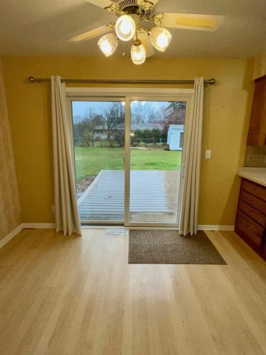 Dining area opens to patio doors and deck