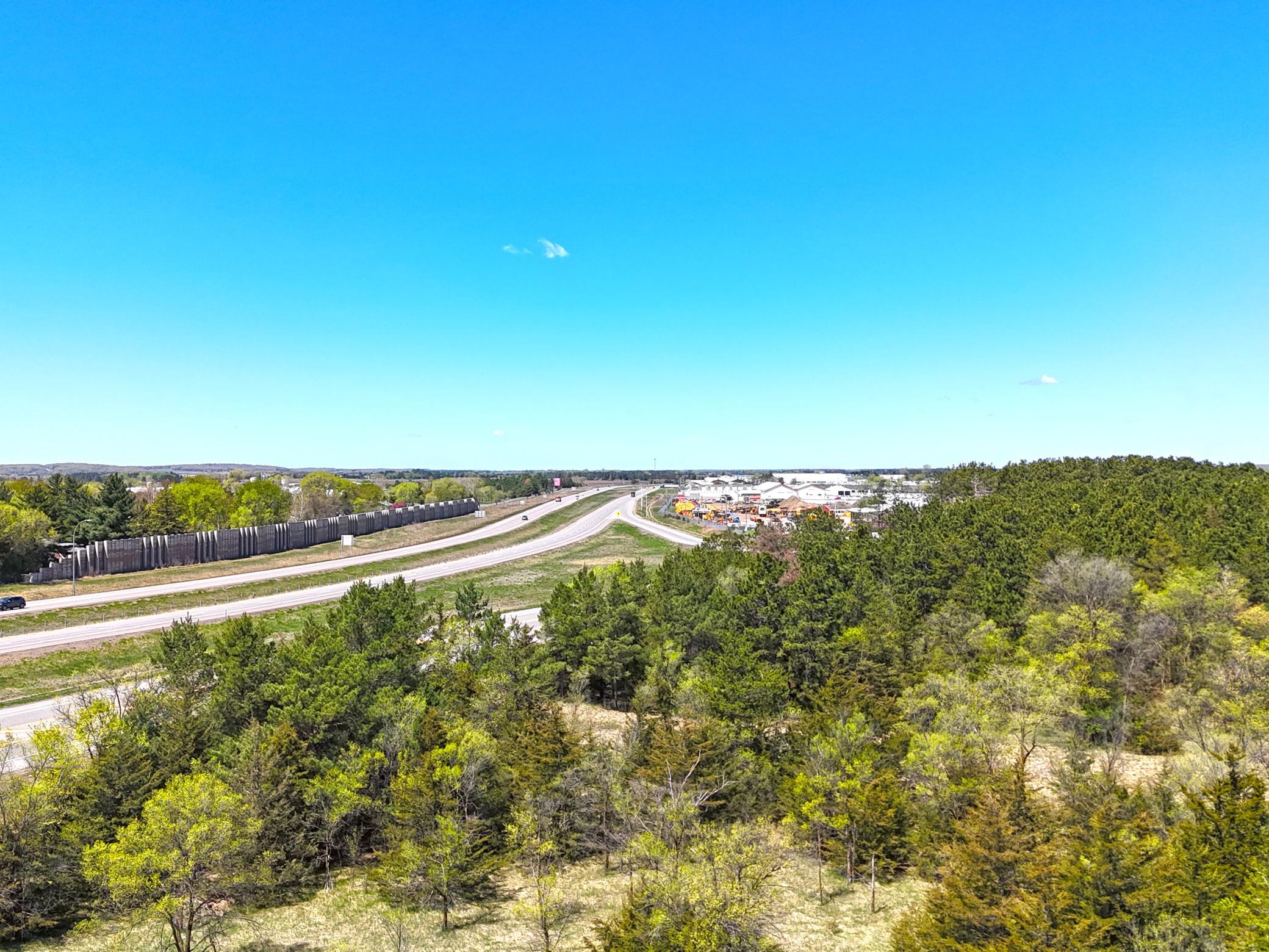 View looking north along the property. 25th Ave NE has an entrance to Hwy 10 N just ahead.jpg