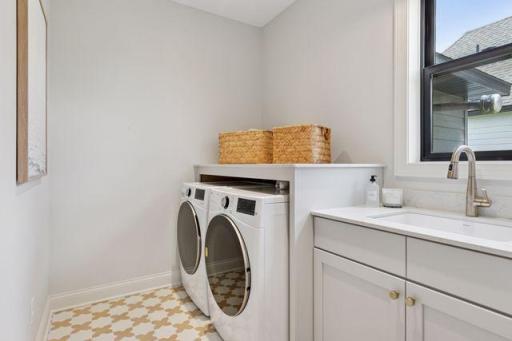 Mudroom flows into the laundry which passes through to the owner's closet
