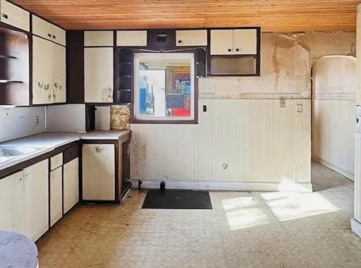 Nice sized kitchen ready to update! Note the wood plank ceilings will be a fun feature to touch up