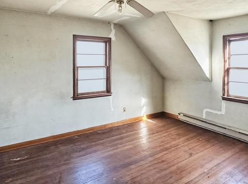 The largest upper level bedroom - more beautiful hardwood flooring ready to shine!