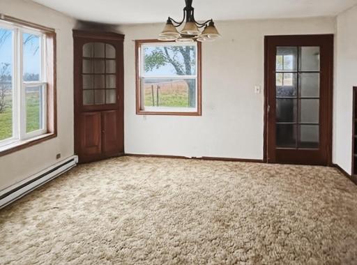 Formal dining room with built-in cabinet and great views to outside