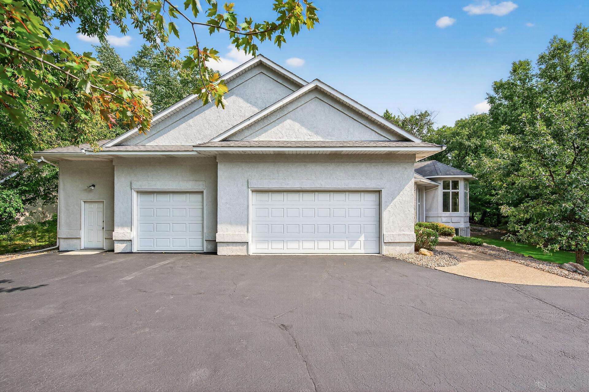 Home includes dream garage with 13 foot ceilings and over 7 garage stalls