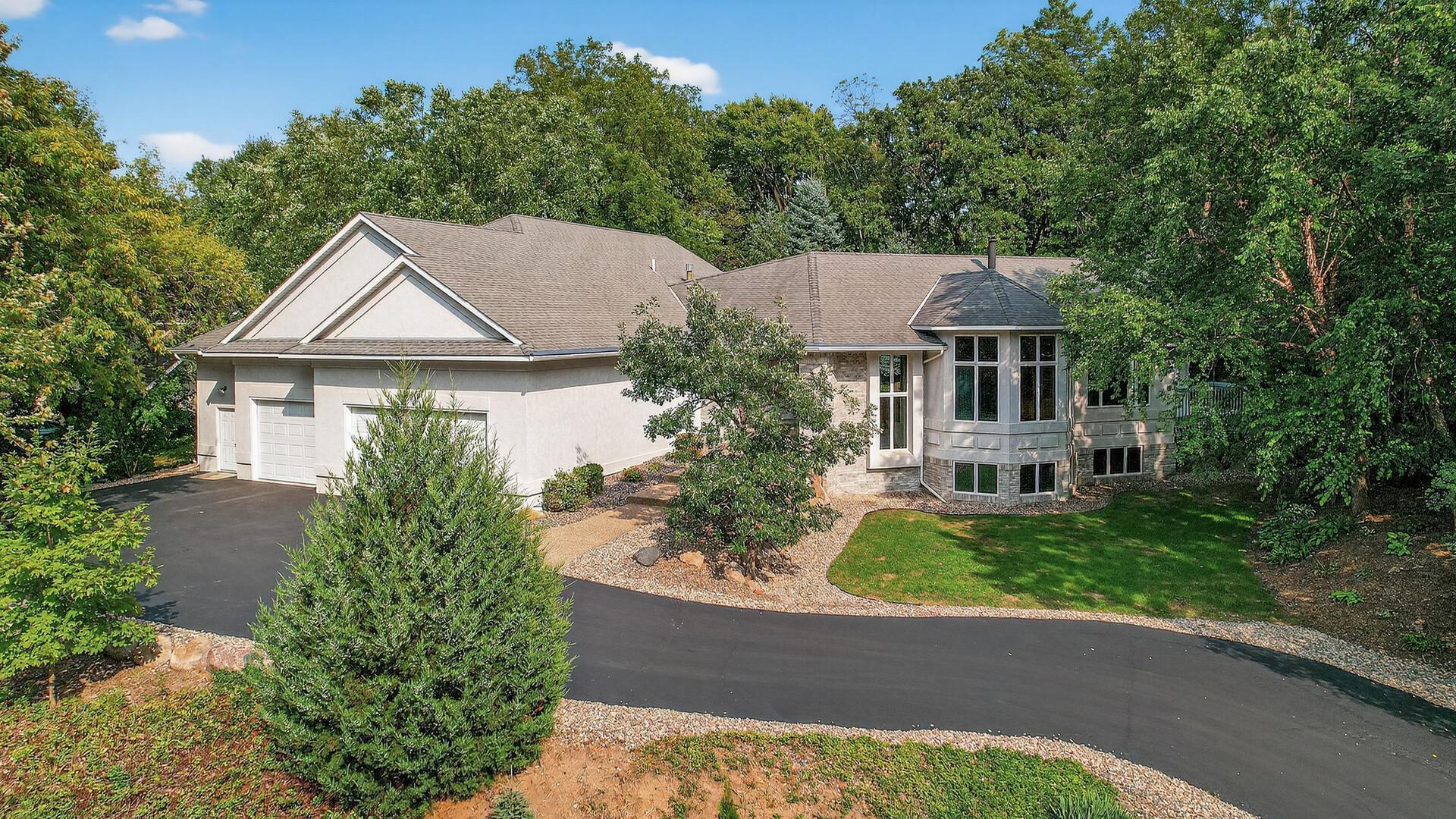 2520 Arbor Court sits on over a half acre, wooded lot in Mendota Heights