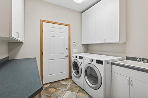 Main Level Laundry Room is conveniently located across the hall from the Owner's Suite