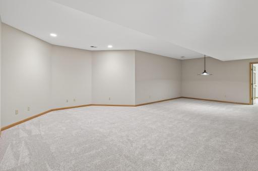 Spacious Lower Level Family Room can accommodate both a TV/entertainment space and a game area