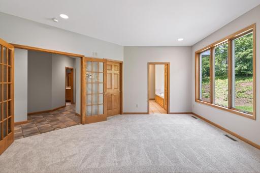 Main Level Owner's Suite fit with walk-in closet and private full bathroom