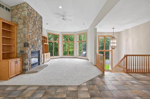 Main Level Living Room with floor-to-ceiling Andersen windows that pour natural light into the home