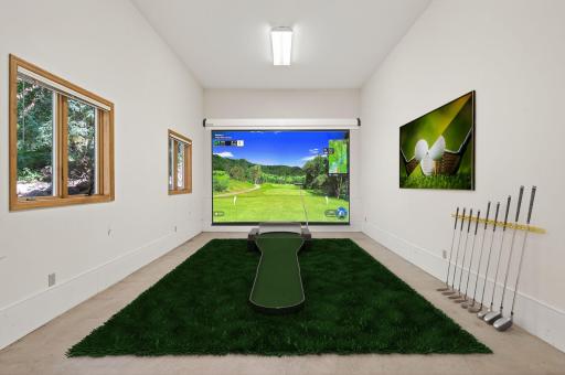 Back Garage Stall - Photo is Virtually Staged. Oversized back garage stall includes In-Floor Heating and provides endless possibilities. Ideal for a golf simulator