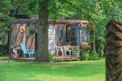 This cozy porch is located in the back yard of the main house