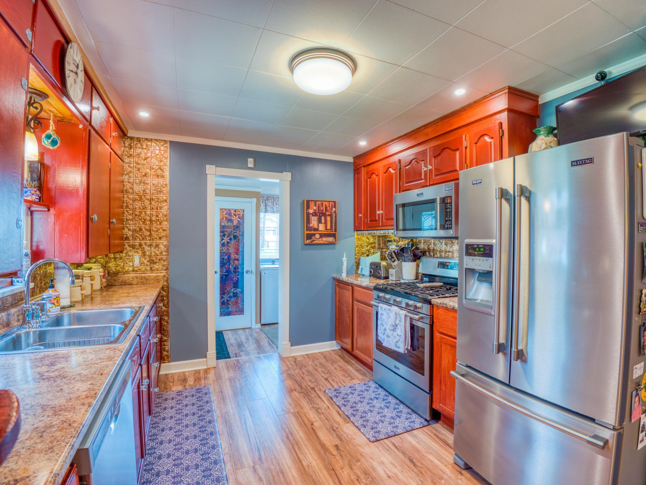 kitchen of main home with stainless appliance package