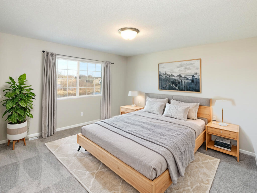 Photo of a different home with similar plan & finishes virtually staged. Primary Suite. Photo may not depict actual plan & finishes.