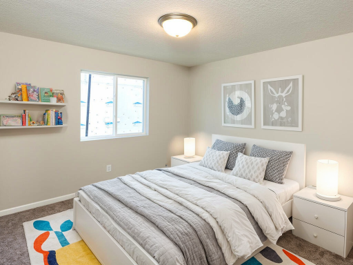 Photo of a different home with similar plan & finishes virtually staged. Bedroom 2. Photo may not depict actual plan & finishes.