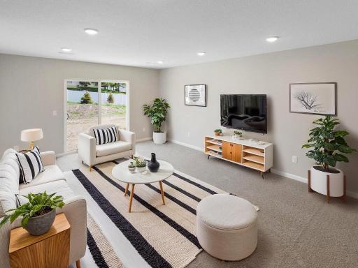 Photo of a different home with similar plan & finishes virtually staged. Lower Level Family Room. Photo may not depict actual plan & finishes.