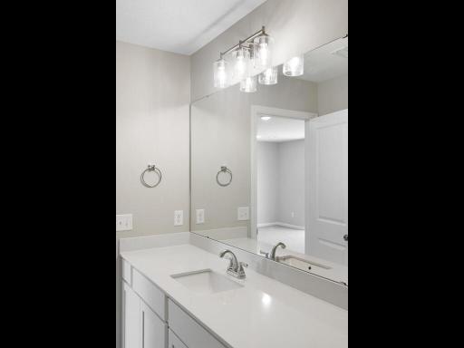 Photo of a different home with similar plan & finishes. Lower Level Full Bathroom. Photo may not depict actual plan & finishes.