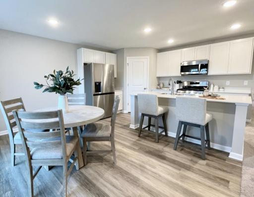 3216 Kady Ave NE- Photo of actual home ready for Quick Move-in! Kitchen features a walk-in pantry and spacious center island.