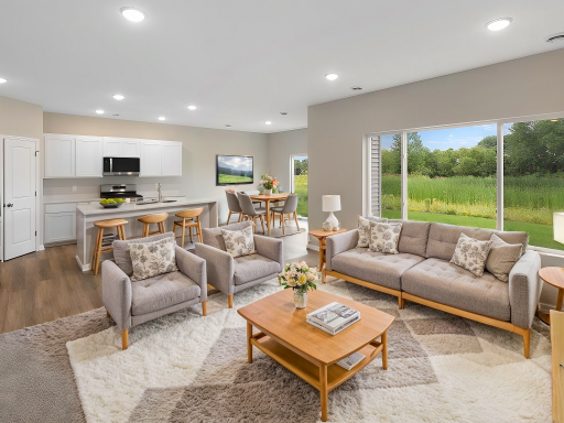 Open Concept Living Space, Virtually Staged. Photo taken of another home with similar plan and finishes. Photos and renderings may not depict actual plan, materials, & finishes may vary. All measurements are approximate.