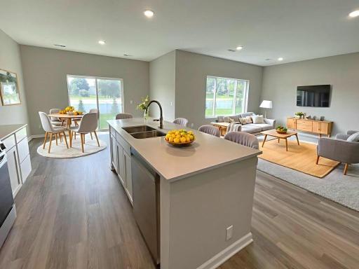 Open Concept Living Space, Virtually Staged. Photo taken of another home with similar plan and finishes. Photos and renderings may not depict actual plan, materials, & finishes may vary. All measurements are approximate.